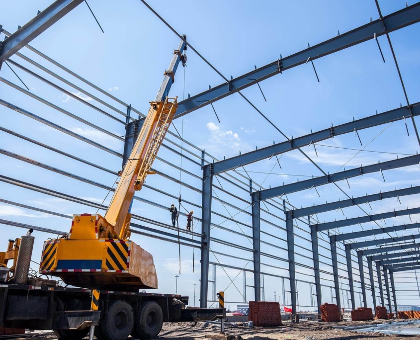 Interior view of workers building large warehouse