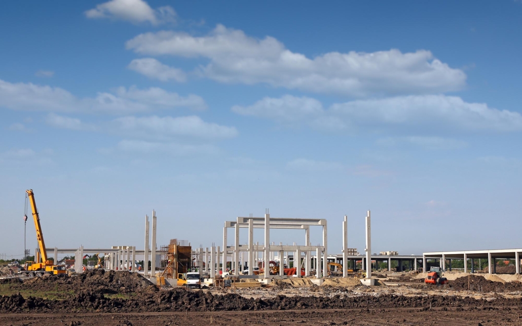 side view of a large Industrial Construction site during the day
